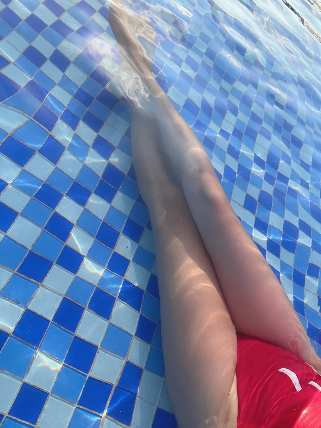 Legs and feet, wading in a Sanya swimming pool #mvTIM2ur